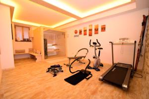 a gym with exercise equipment in a room at Albergo Stelvio in Bormio