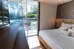 Postel nebo postele na pokoji v ubytování Libertg Hotels Spa Medellin