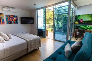 TV a/nebo společenská místnost v ubytování Libertg Hotels Spa Medellin