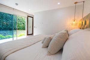 Postel nebo postele na pokoji v ubytování Libertg Hotels Spa Medellin