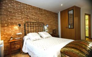 Cama o camas de una habitación en El Rincón del Tarabilla