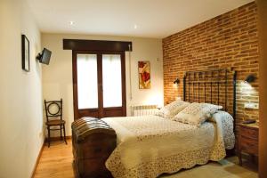 Cama o camas de una habitación en El Rincón del Tarabilla