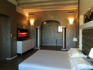 Postel nebo postele na pokoji v ubytování Hotel Morgana
