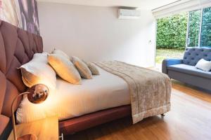 Postel nebo postele na pokoji v ubytování Libertg Hotels Spa Medellin