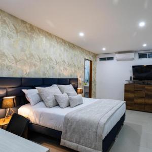 Postel nebo postele na pokoji v ubytování Libertg Hotels Spa Medellin