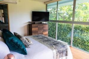 TV a/nebo společenská místnost v ubytování Libertg Hotels Spa Medellin