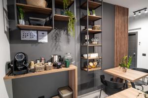 a room with wooden shelves and a table at MIA Rooms B&B in Milazzo