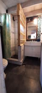 a bathroom with a sink and a mirror at DiversidadMDP in Mar del Plata