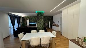 a living room with a white table and chairs at 085 luxury apartment in Montesilvano