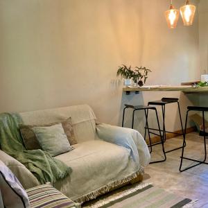 a living room with a couch and a table at Cuenca del Bosque in Tandil