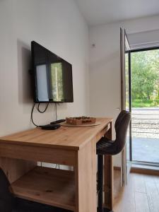 TV i/ili multimedijalni sistem u objektu Vožd Apartman Divcibari