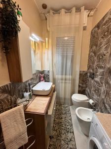 a bathroom with a sink and a toilet and a shower at Verona green harmony in Verona +53 photos