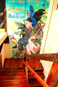 a mural of birds on the side of a staircase at Hotel Rosa del Alba, Barrio Mágico Centro Histórico de Chetumal in Chetumal