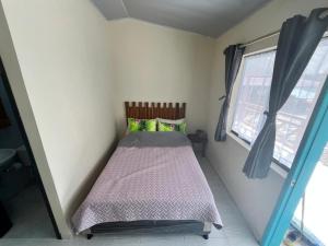 Una cama o camas en una habitación de Posada Lili