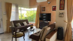 Televisyen dan/atau pusat hiburan di Casa con Air Hockey, Bolirana, Wi-Fi y Piscina
