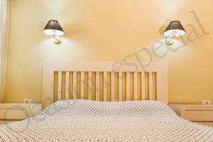 Ένα ή περισσότερα κρεβάτια σε δωμάτιο στο Apartamentos Lago Oceanfront with Los Gigantes and La Gomera Views