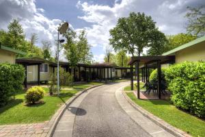 A garden outside Flaminio Village Bungalow Park