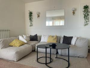 a living room with a couch and a table at 'Il Duomo' nel centro di Frascati in Frascati +16 photos