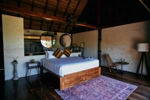 Postel nebo postele na pokoji v ubytování Libelula Tulum Beachfront Hotel