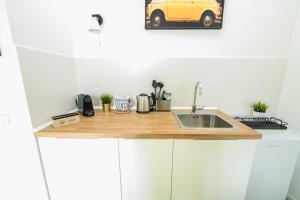 Kuchyň nebo kuchyňský kout v ubytování Valguarnera Studio Apartments