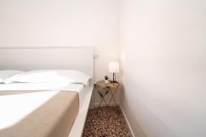 Postel nebo postele na pokoji v ubytování Valguarnera Studio Apartments