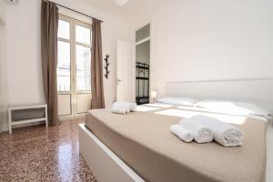 Postel nebo postele na pokoji v ubytování Valguarnera Studio Apartments