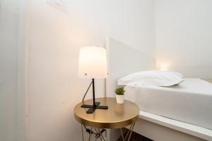 Postel nebo postele na pokoji v ubytování Valguarnera Studio Apartments