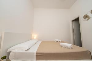 Postel nebo postele na pokoji v ubytování Valguarnera Studio Apartments