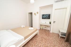Postel nebo postele na pokoji v ubytování Valguarnera Studio Apartments