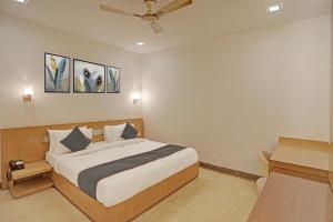 Ένα ή περισσότερα κρεβάτια σε δωμάτιο στο Townhouse RELAX SUITS A BOUTIQUE HOTEL VASUNDHARA