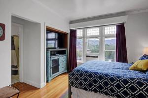 a bedroom with a bed and a large window at B Street C in Salt Lake City