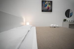 Postel nebo postele na pokoji v ubytování Valguarnera Studio Apartments