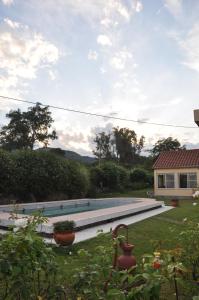 a swimming pool in the yard of a house at Finca Cielo Verde in Chicoana