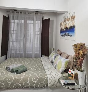 a bedroom with a bed and a glass table at Monnalisa House - Imola Centro Storico - Appartamento Indipendente in Imola