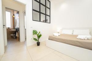 Postel nebo postele na pokoji v ubytování Valguarnera Studio Apartments