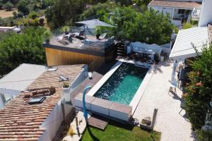 an overhead view of a swimming pool on a house at Tiny house in São Brás de Alportel