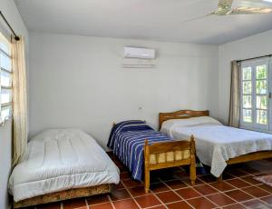 Postel nebo postele na pokoji v ubytování Un Oasis Natural a Minutos de Asunción