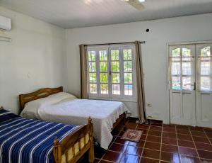 Postel nebo postele na pokoji v ubytování Un Oasis Natural a Minutos de Asunción
