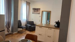 a kitchen and living room with a table and chairs at City Vibes Koblenz in Koblenz +20 photos
