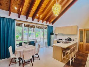 a kitchen and dining room with a table and chairs at Peaceful home in forest in Wonga Park
