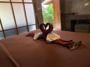 a couple of swans sitting on top of a bed at Coconut Lanta Resort @Klong Dow beach in Ko Lanta +256 photos