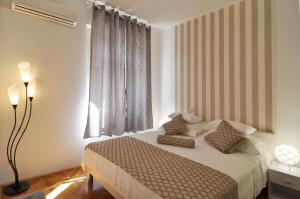 Postel nebo postele na pokoji v ubytování Apartment Karmen