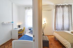 Postel nebo postele na pokoji v ubytování Apartment Karmen