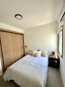 Ένα ή περισσότερα κρεβάτια σε δωμάτιο στο "Complejo Punto Tilo" apartamento Luna