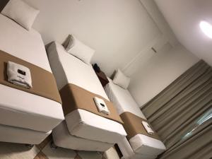 Letto o letti in una camera di Hotel Mega