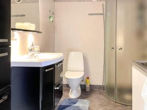a bathroom with a toilet and a sink and a shower at 4 star holiday home in UDDEVALLA in Uddevalla +35 photos