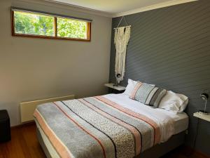 Voodi või voodid majutusasutuse The Views Cottage toas +7 fotot