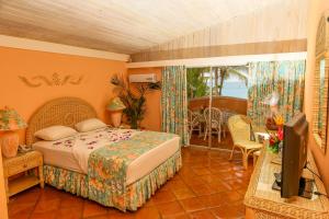 Katil atau katil-katil dalam bilik di Coco Reef Resort & Spa