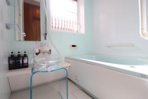 a white bathroom with a sink and a glass table at Ideal Momodani イデアール桃谷 in Osaka +66 photos