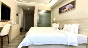 Photo de la galerie de l'établissement JTOUR Inn Maoming Huazhou Beijing Road Railway Station, à Maoming